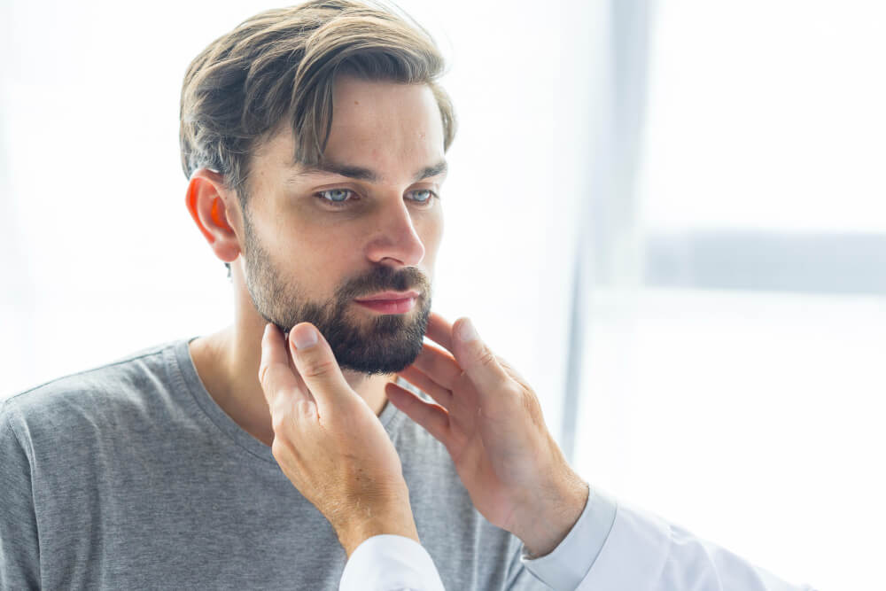 doctor checking beard after transplant